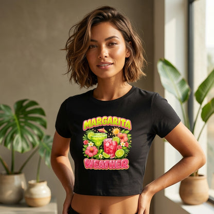 Black girls crop top featuring colorful Margarita Weather tropical cocktail graphic with lime slices, flowers, and vibrant summer artwork.