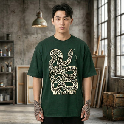 GREEN oversized t shirt with tribal snake graphic and raw instinct text